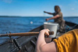 Net fishing from a rowing boat
